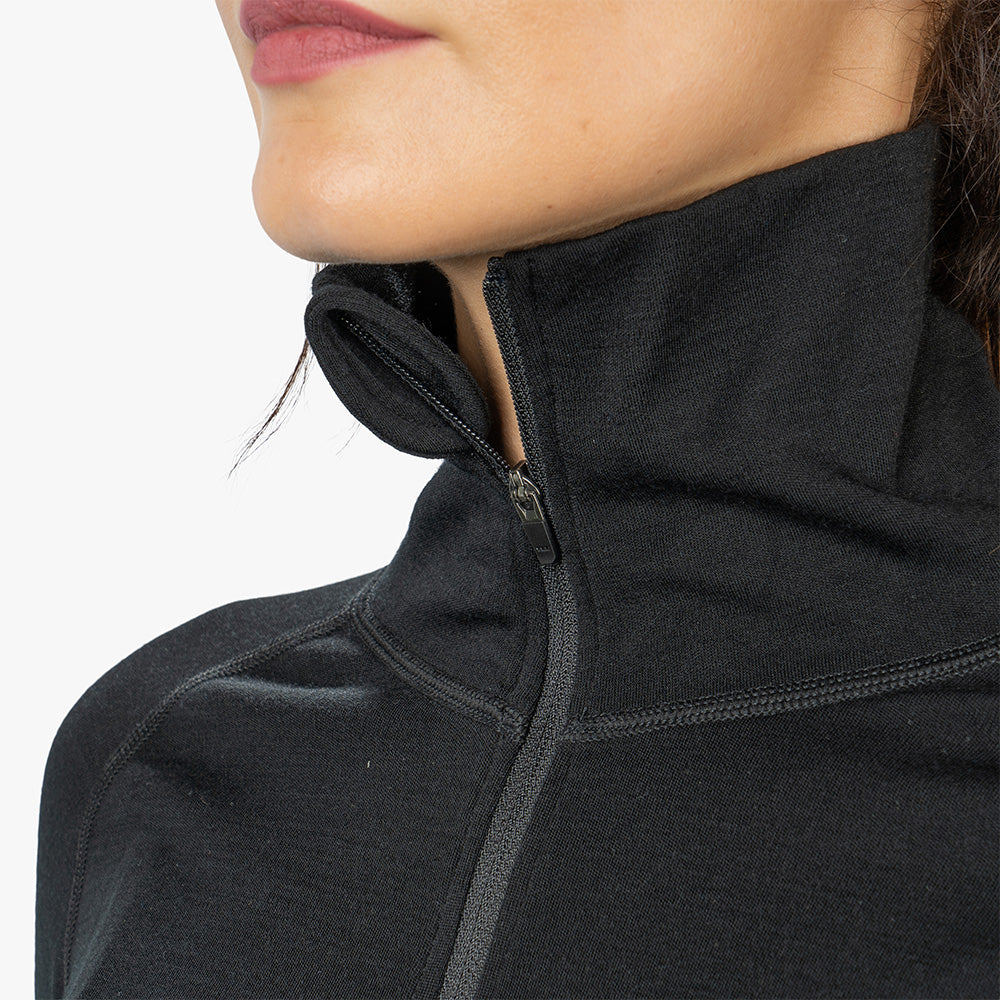 m2, zeigt schwarzen, zipbaren Kragen mit verstärkter Naht und Kinnschutz aus 100% Merinowolle für Outdoor-Aktivitäten.