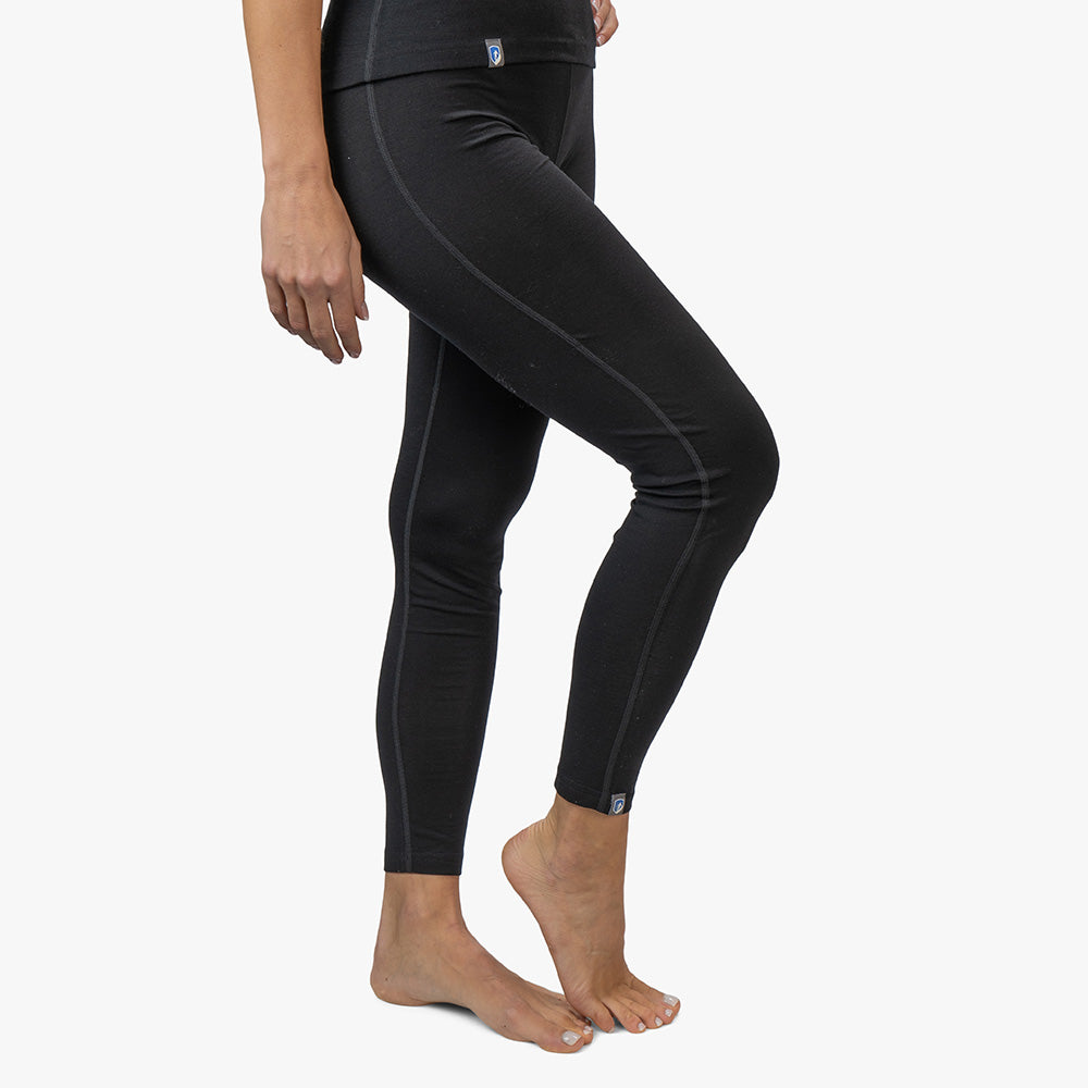 m2: Slim-fit schwarze Leggings, ideal für Outdoor-Aktivitäten, kombiniert Komfort von Merinowolle mit robuster CORESPUN-Technologie.