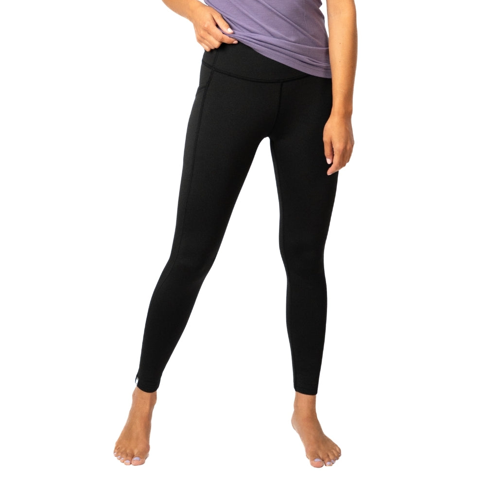 Merino Leggings/Hose Damen - 290 g/m2: Person trägt schwarze Leggings mit hohem Bund, ideal für Yoga und Alltag, mit Seitentasche für Smartphone.