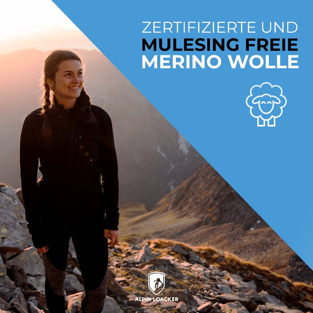 Frau auf Felsen trägt Merino Jacke Damen 270 g/m2, ideal für Outdoor-Abenteuer, bietet Komfort und Funktionalität durch Merinowolle, Bambus-Viskose und Spandex.