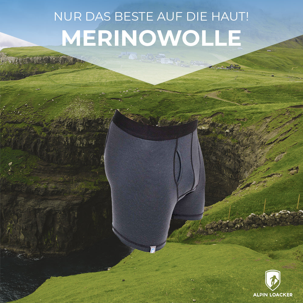 Merino Boxershorts Herren 150 g/m² auf grünem Hügel, ideal für Outdoor-Aktivitäten, vereint Komfort und Funktionalität mit CORESPUN-Technologie, atmungsaktiv und geruchsneutral.